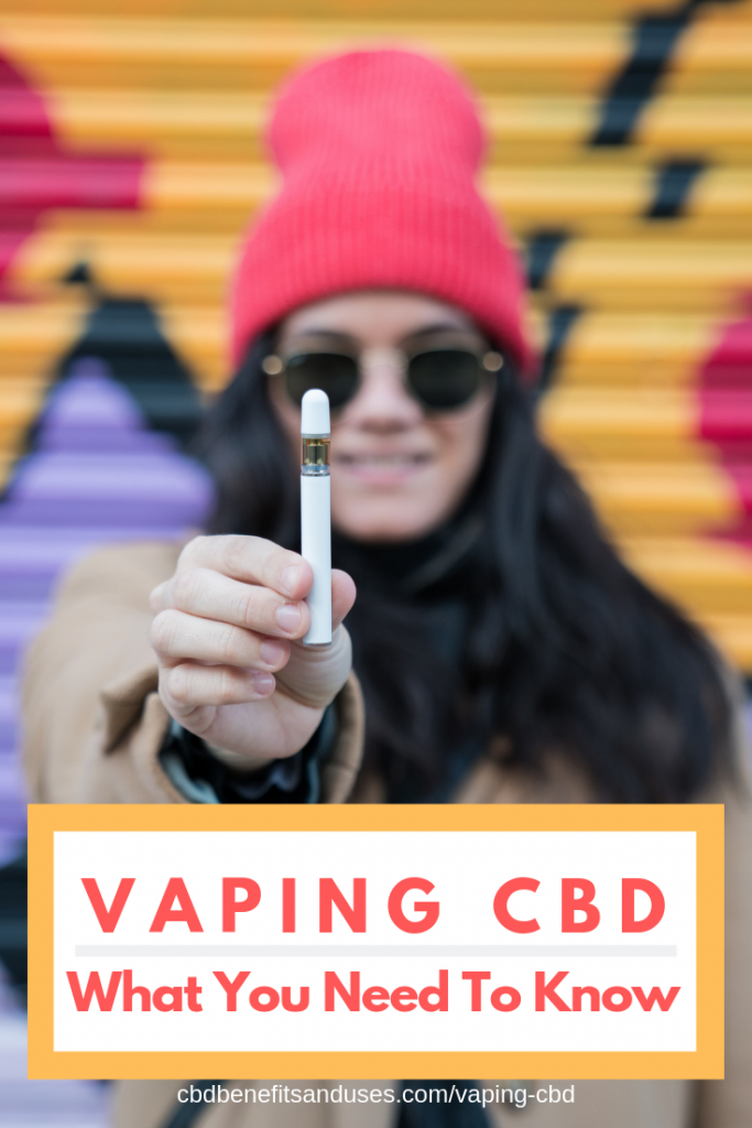 woman vaping cbd pen
