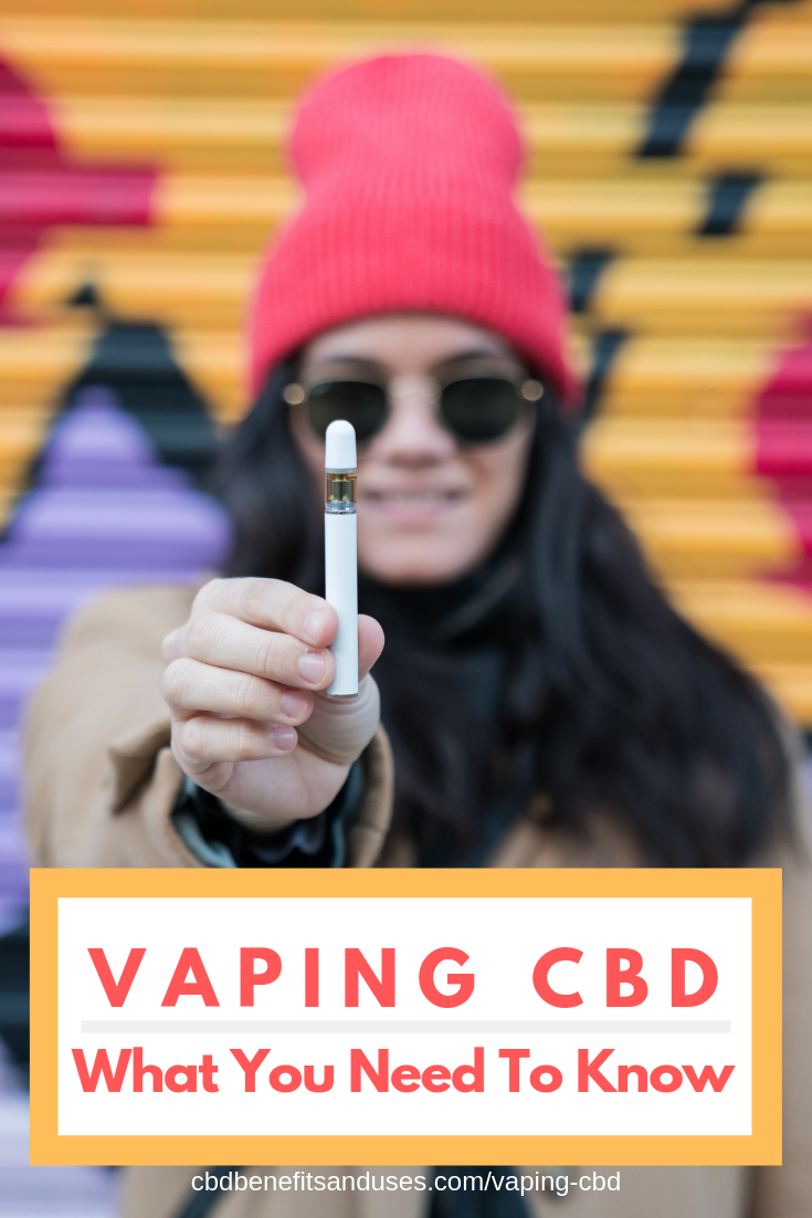 woman vaping cbd pen